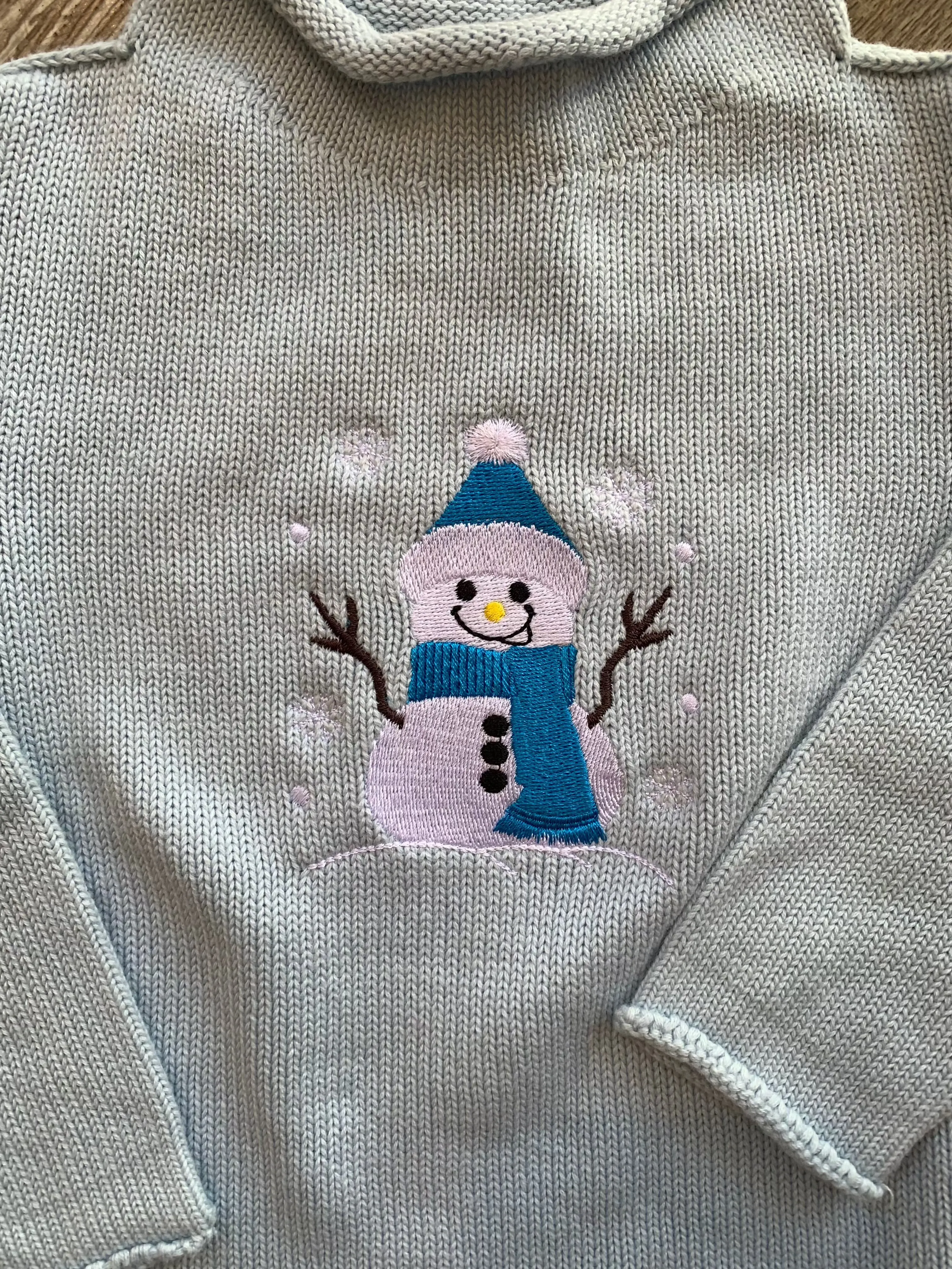 A Soft Idea Roll Neck Sweater in Light Blue with Snowman